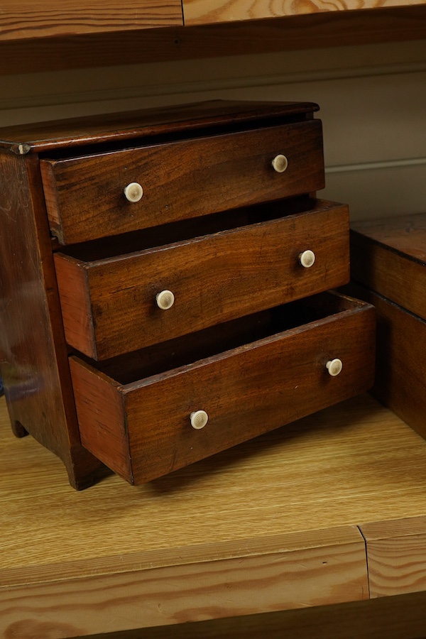 A small 19th century mahogany chest of three drawers having bone handles, width 26cm, height 26cm and a Victorian parquetry banded box, largest 26cm high. Condition - fair